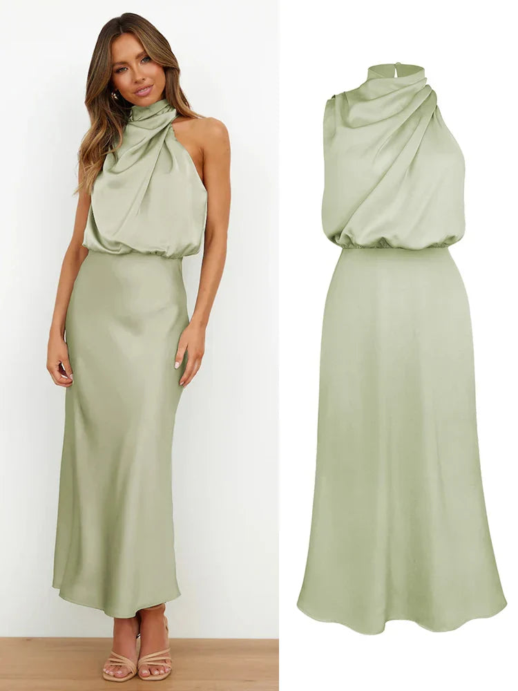 Letnia sukienka midi z asymetrycznym dekoltem halter. Elegancka satynowa kreacja na imprezę.