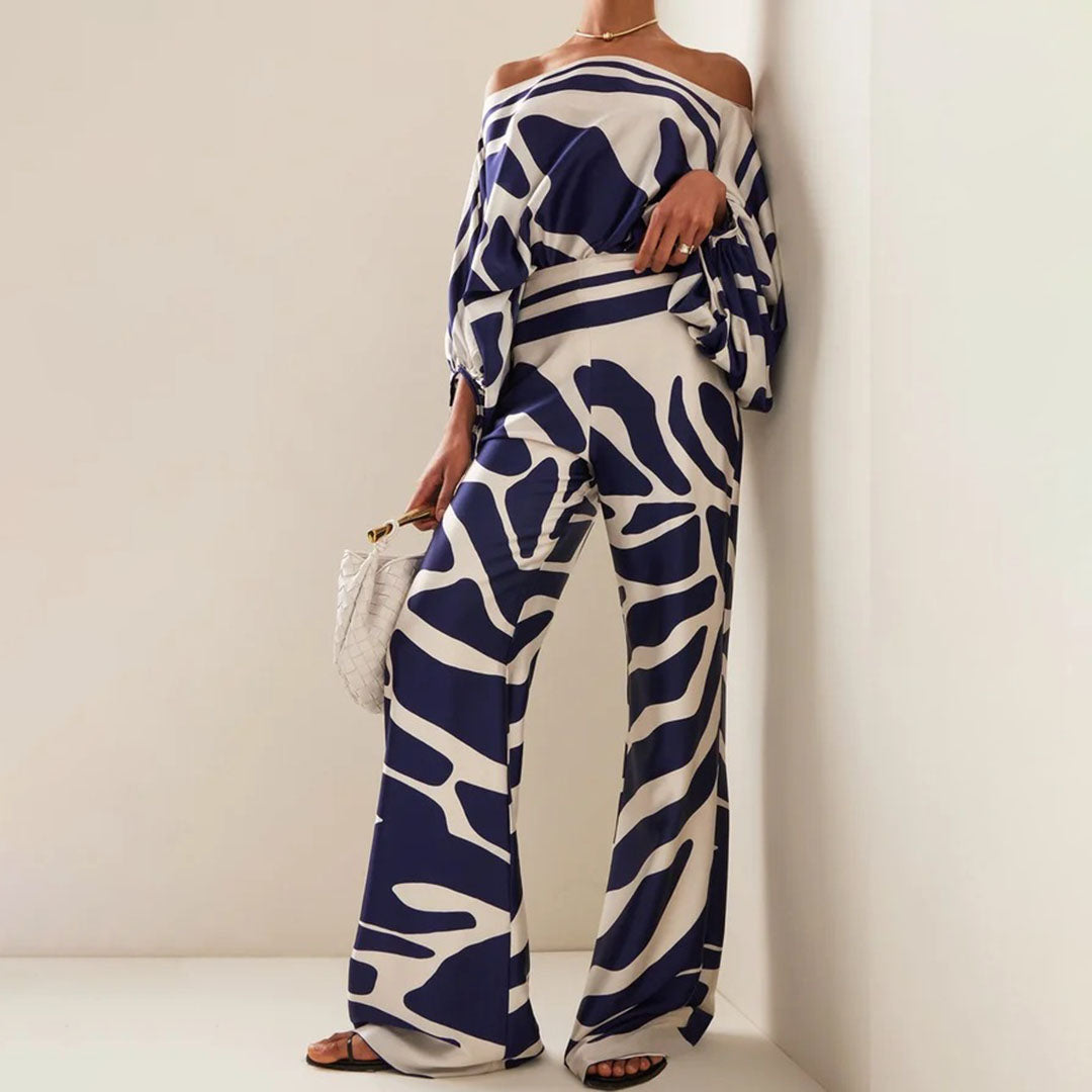 Stylowy komplet damski z szerokimi spodniami i topem off-shoulder, idealny na letnie wyjścia.