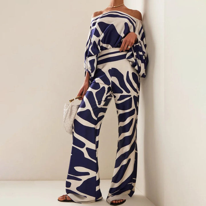 Stylowy komplet damski z szerokimi spodniami i topem off-shoulder, idealny na letnie wyjścia.