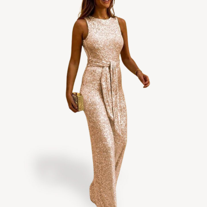 Modny kombinezon sylwestrowy damski z cekinami, elegancki fason maxi, styl glamour.