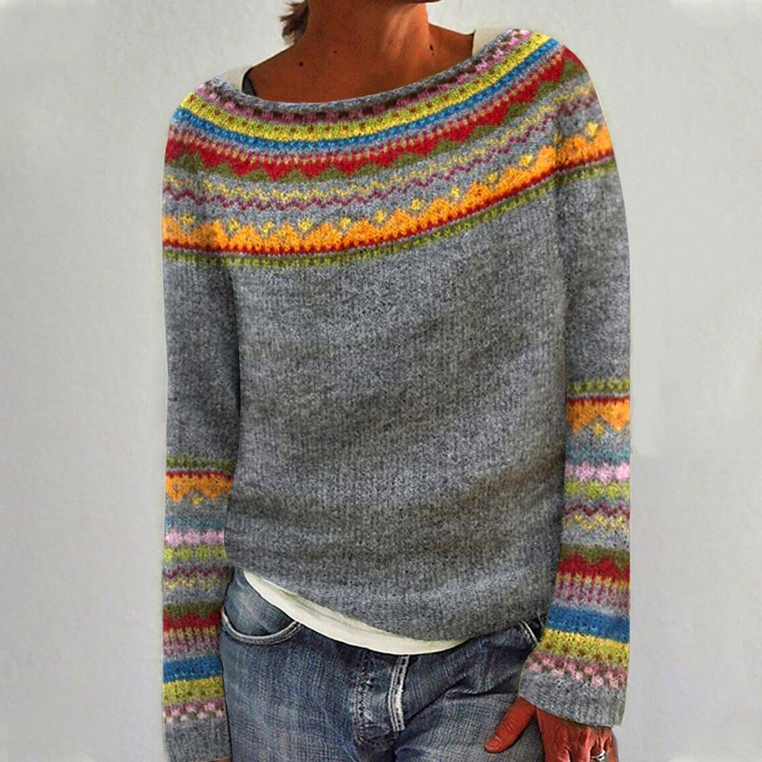 Komfortowy szary sweter damski na zimę. Ciepły i modny, doskonale sprawdzi się w eleganckich i casualowych stylizacjach.