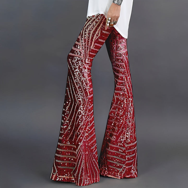 Damskie błyszczące spodnie z cekinami, rozkloszowany fason, idealne na wyjście. Elegancki look imprezowy.