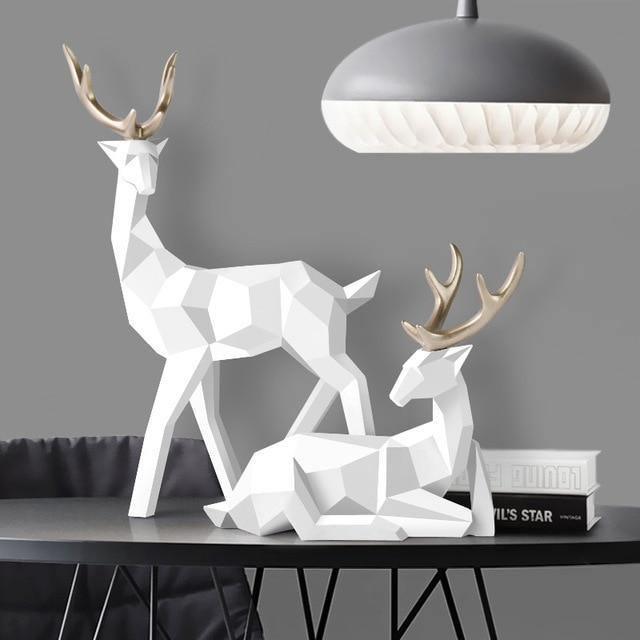 Zestaw eleganckich figurek reniferów, dekoracje skandynawskie do salonu, nowoczesny styl minimalistyczny.
