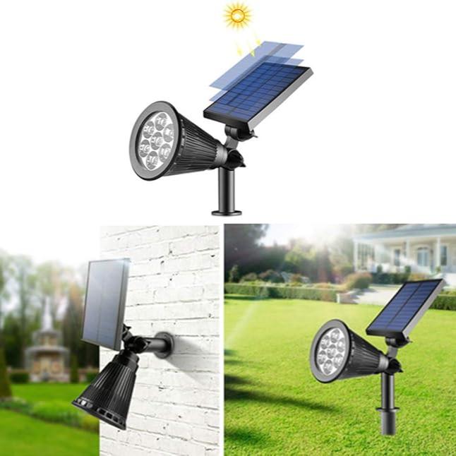 Reflektor ogrodowy solarny LED zamontowany przy ścieżce w ogrodzie