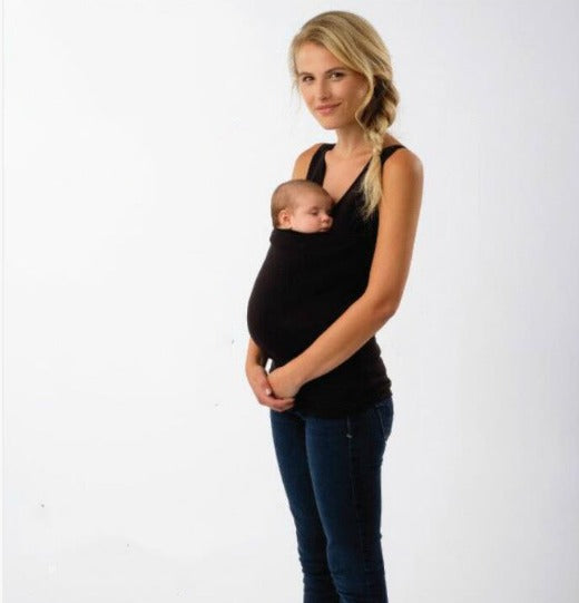 Nowoczesne nosidełko dziecięce w szarym odcieniu, zapewniające bliskość i styl dla aktywnych rodziców.