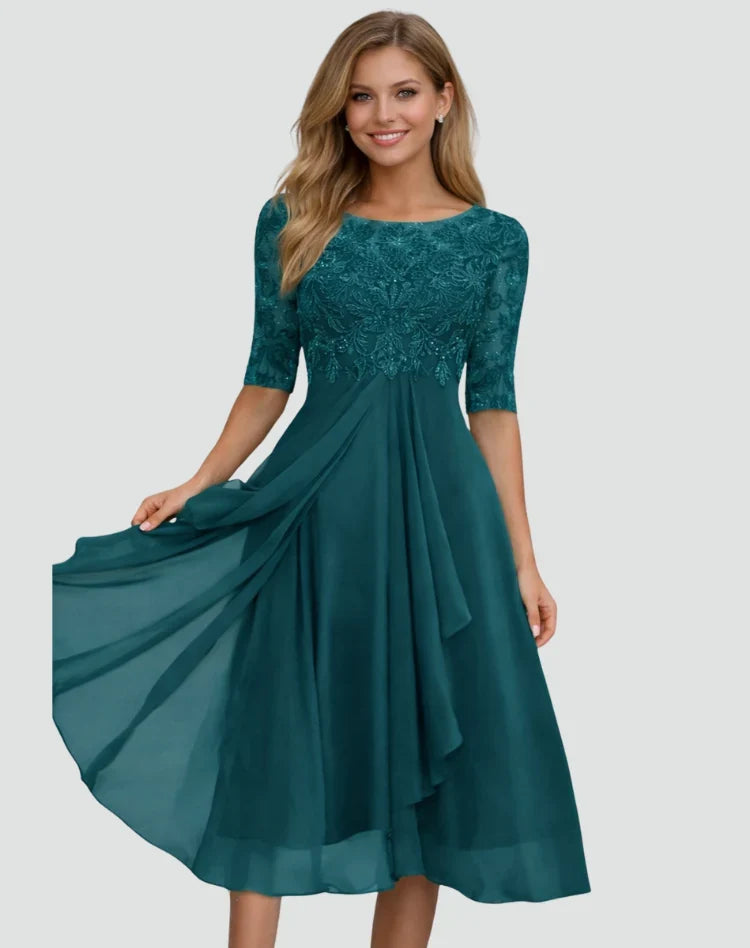 Koronkowa sukienka midi w eleganckim stylu, zbliżenie na materiał