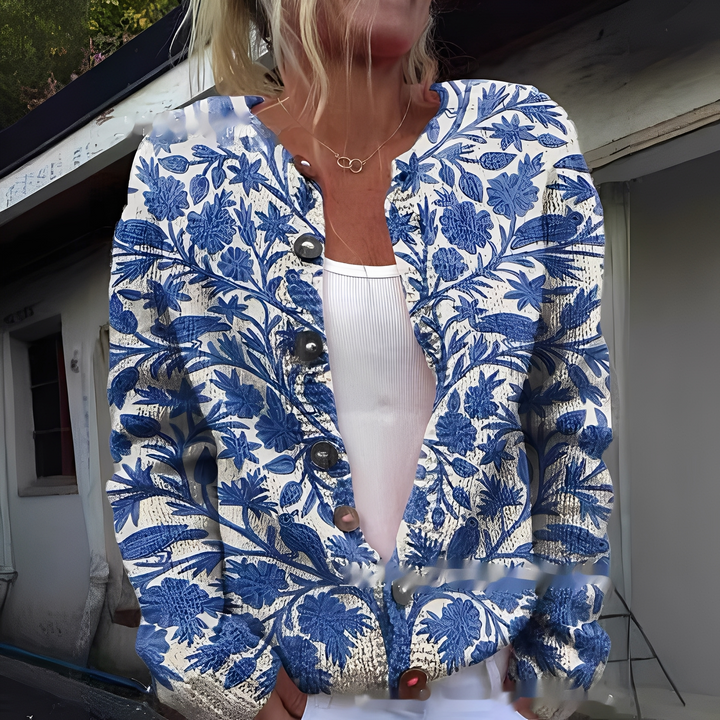 Elegancki kardigan damski w kwiaty. Wygodny sweter na casualowe stylizacje, dostępny także w dużych rozmiarach.