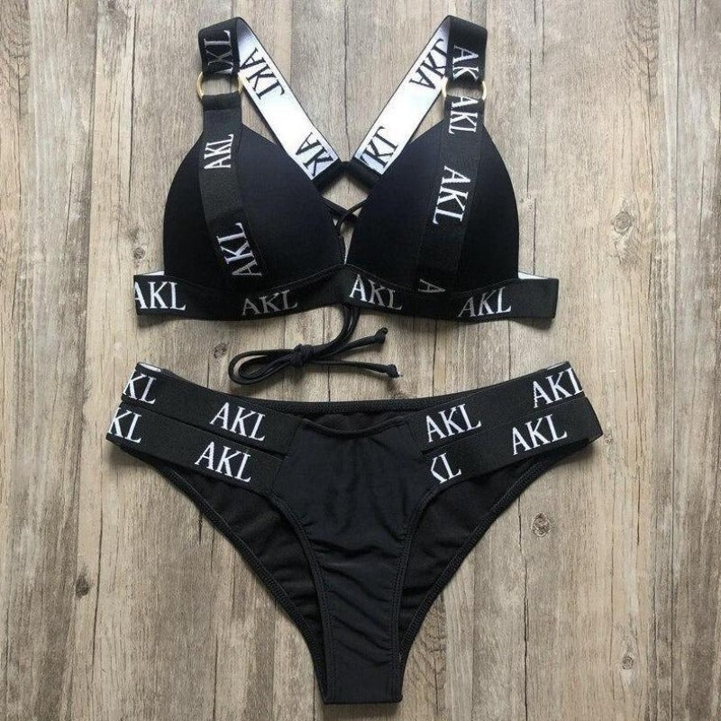 Stylowe damskie bikini dwuczęściowe z wiązaniem, idealne na plażę. Klasyczny czarny i biały strój kąpielowy.