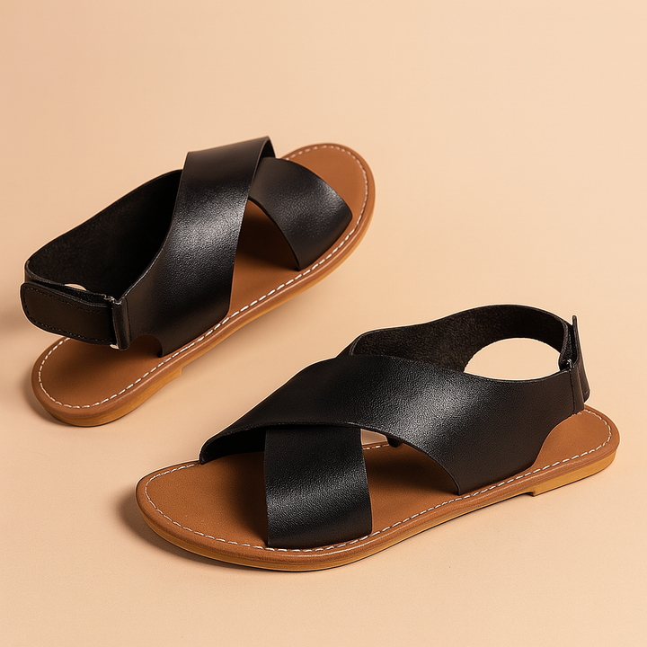Brązowe klasyczne sandały damskie z krzyżującymi paskami. Stylowe i wygodne obuwie na lato.