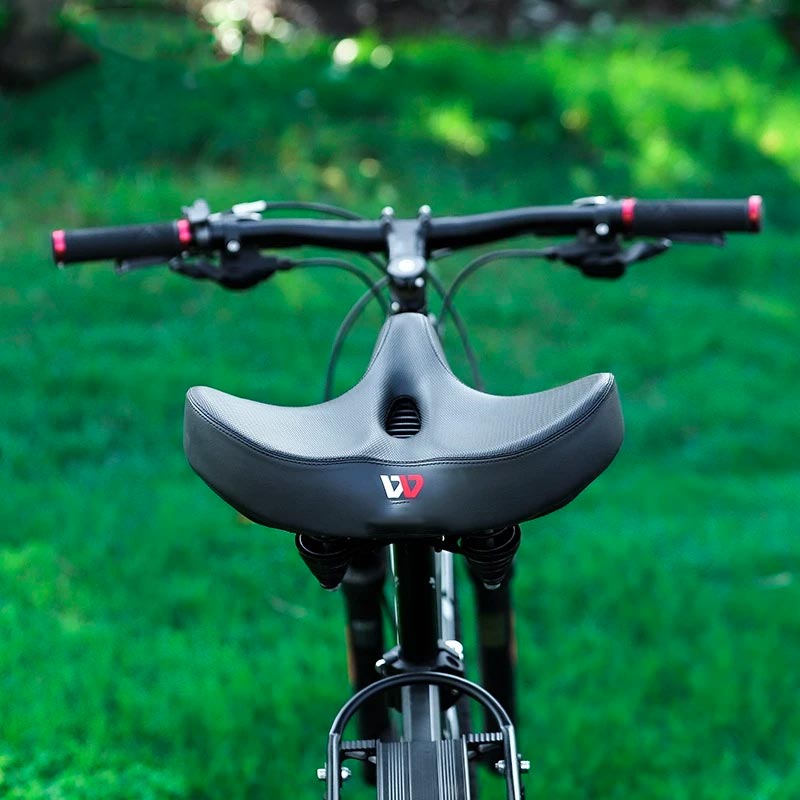 Ergonomiczne siodełko rowerowe z amortyzacją, zapewniające wygodę. Pasuje do roweru miejskiego i górskiego.