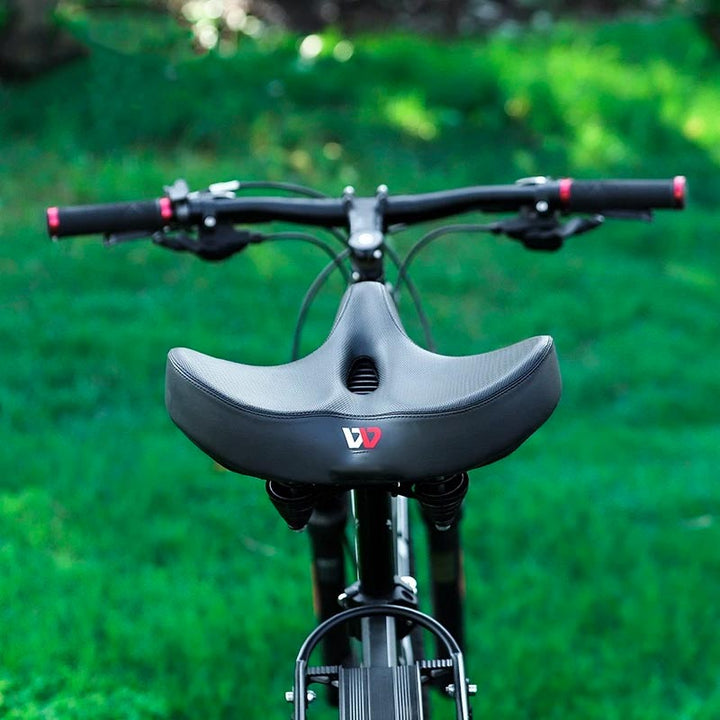 Ergonomiczne siodełko rowerowe z amortyzacją, zapewniające wygodę. Pasuje do roweru miejskiego i górskiego.