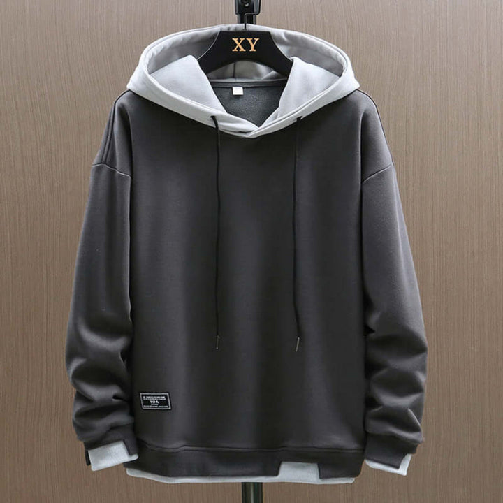 Stylowa męska bluza oversize z kapturem, zapewniająca swobodny look i komfort noszenia w streetwearze.