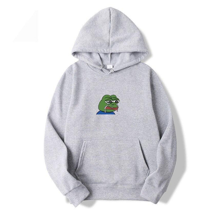 Mężczyzna w modnej, komfortowej bluzie z kapturem i nadrukiem żaby. Swobodna męska odzież casual.
