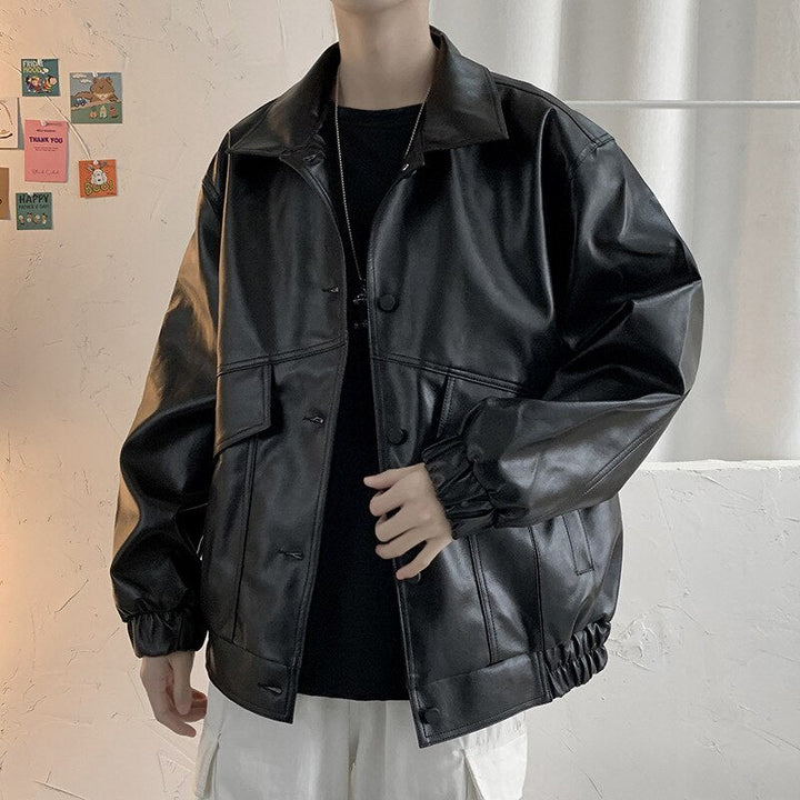 Męska czarna kurtka skórzana oversize z eko-skóry, zapinana na guziki, idealna do casualowych stylizacji.