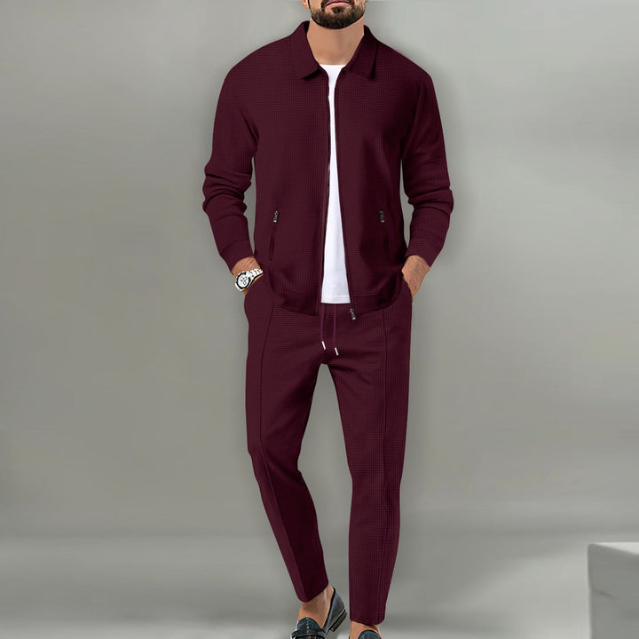 Elegancki dres męski z bluzą dresową i spodniami. Komplet całoroczny, idealny do modnej stylizacji casualowej.