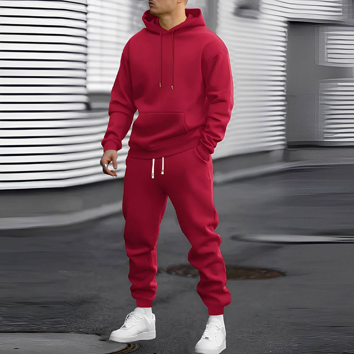 Stylowy męski dres z kapturem na jesień i zimę. Nowoczesny komplet casual, bluza i spodnie. Odzież sportowa.