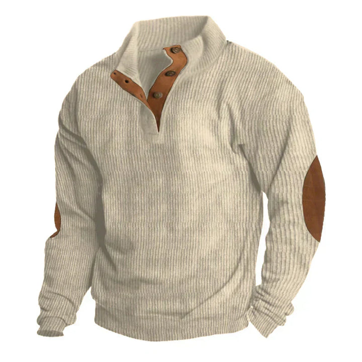 Elegancki sweter męski Armand z łatami na łokciach. Klasyczny krój, idealny na chłodne dni jesieni i zimy.