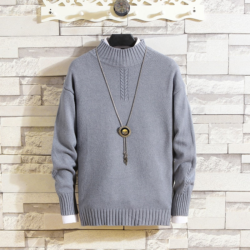 Dopasowany męski golf, podkreślający sylwetkę. Modny sweter z ozdobnym detalem, idealny do casualowych stylizacji.