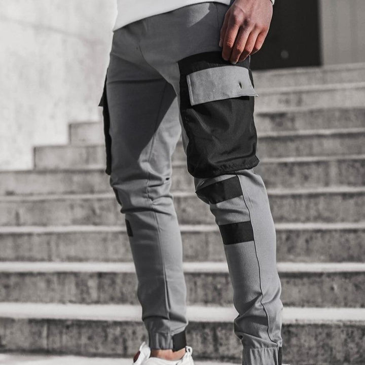 Męskie bojówki dwukolorowe ze ściągaczami, idealne do casualowych stylizacji. Slim fit, z kieszeniami.