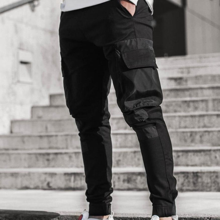 Modne dwukolorowe bojówki męskie ze ściągaczami. Sportowe spodnie slim fit z praktycznymi kieszeniami cargo.