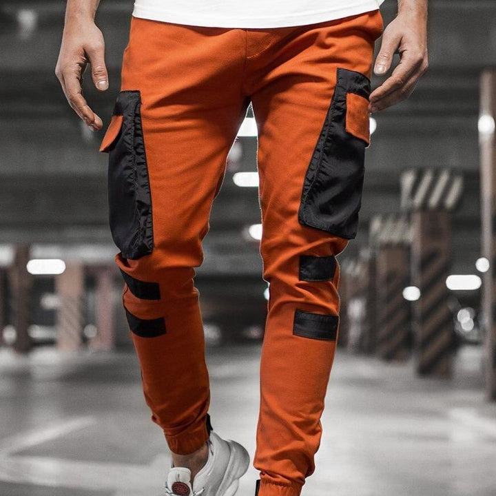 Męskie bojówki dwukolorowe ze ściągaczami. Wygodne spodnie slim fit z wieloma funkcjonalnymi kieszeniami.