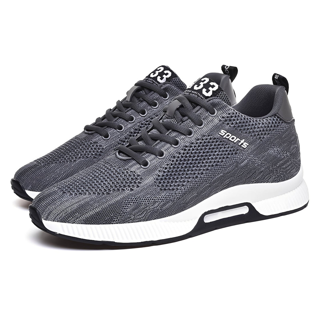 Modne męskie buty sportowe z oddychającą cholewką, zapewniające wygodę i styl na każdą okazję.
