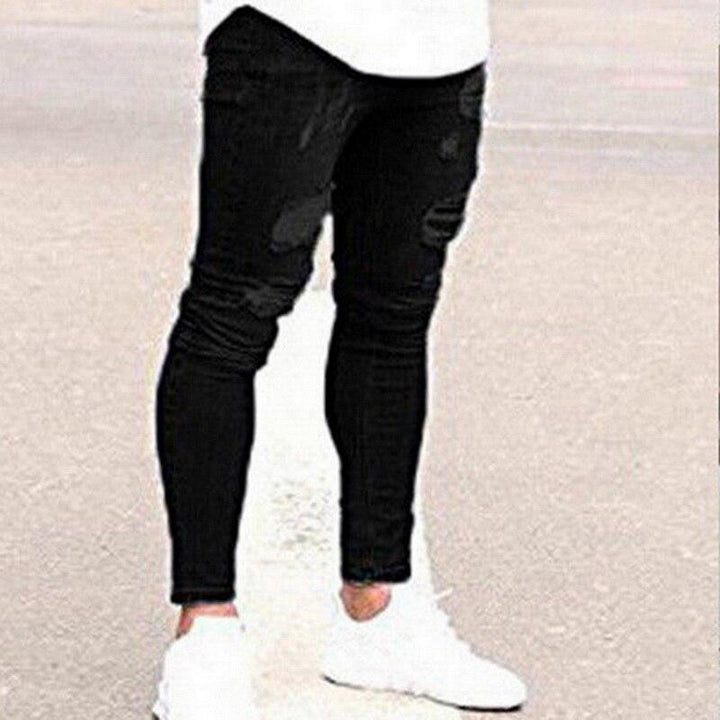Czarne męskie jeansy slim fit z modnymi przetarciami, stylowe dopasowane spodnie na co dzień.