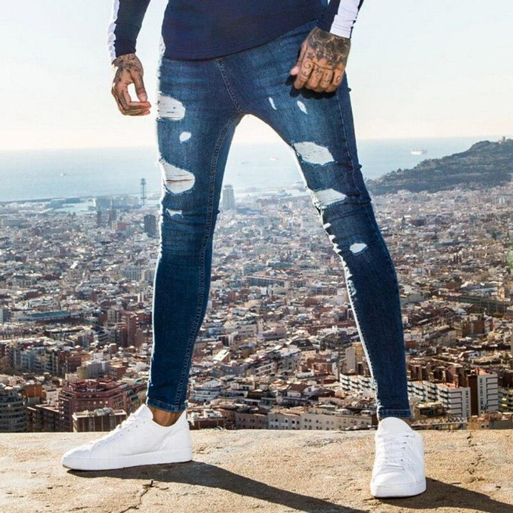 Granatowe męskie jeansy slim fit z przetarciami, wygodne casualowe spodnie męskie.