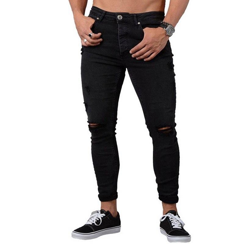 Męskie jeansy slim fit w klasycznym odcieniu niebieskiego. Stylowe spodnie casual, idealne do modnych stylizacji.