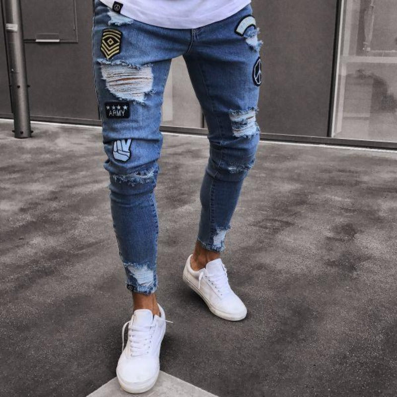 Męskie jeansy slim fit z modnymi dziurami, artystycznymi nadrukami i efektem sprania. Idealne do streetwearu.