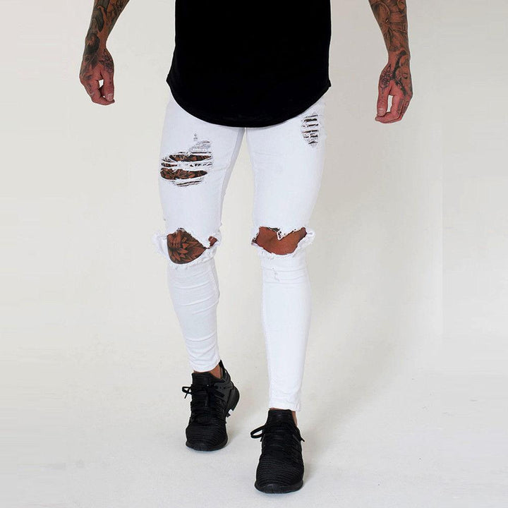 Męskie jeansy slim fit z modnymi dziurami, idealne do casualowych stylizacji i streetwearu. Komfortowe spodnie.