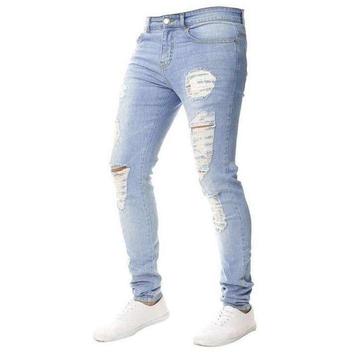 Granatowe męskie jeansy slim fit z przetarciami. Modne, podkreślające sylwetkę, doskonałe do miejskich stylizacji.