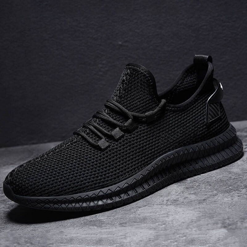 Męskie sportowe sneakersy z lekkiej siateczki, zapewniające komfort i przewiewność.