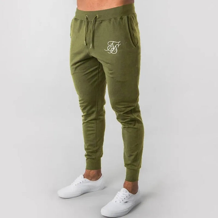 Męskie spodnie dresowe z nadrukiem, idealne do swobodnych outfitów. Sportowy komfort w modnym, streetwearowym wydaniu.