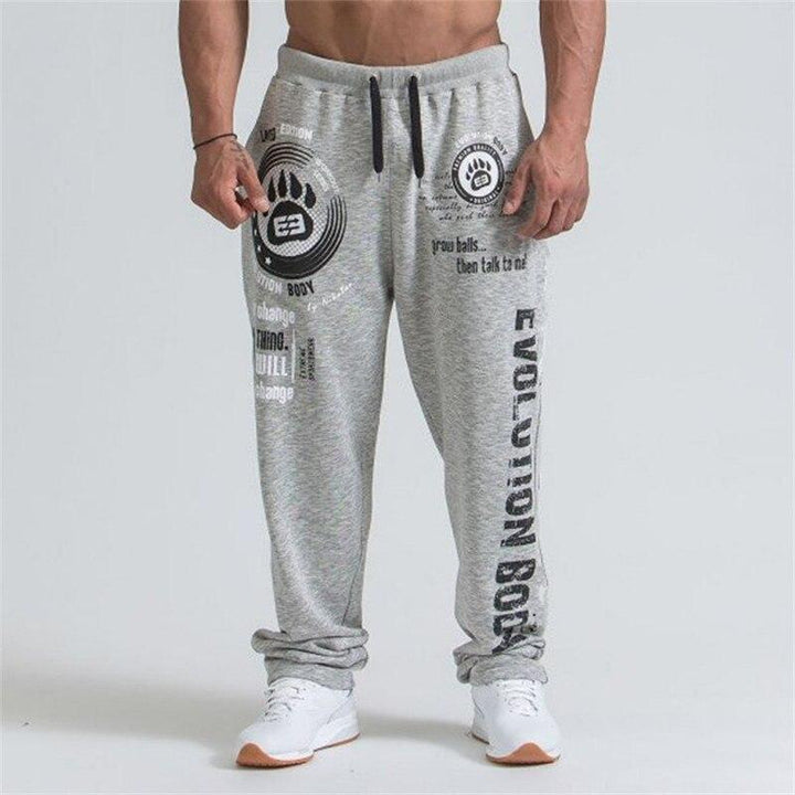 Męskie spodnie dresowe w stylu streetwear, z wyraźnym nadrukiem. Wygodne i sportowe.