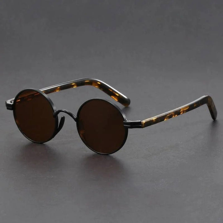 Czarne okrągłe okulary przeciwsłoneczne retro z ozdobnymi zausznikami