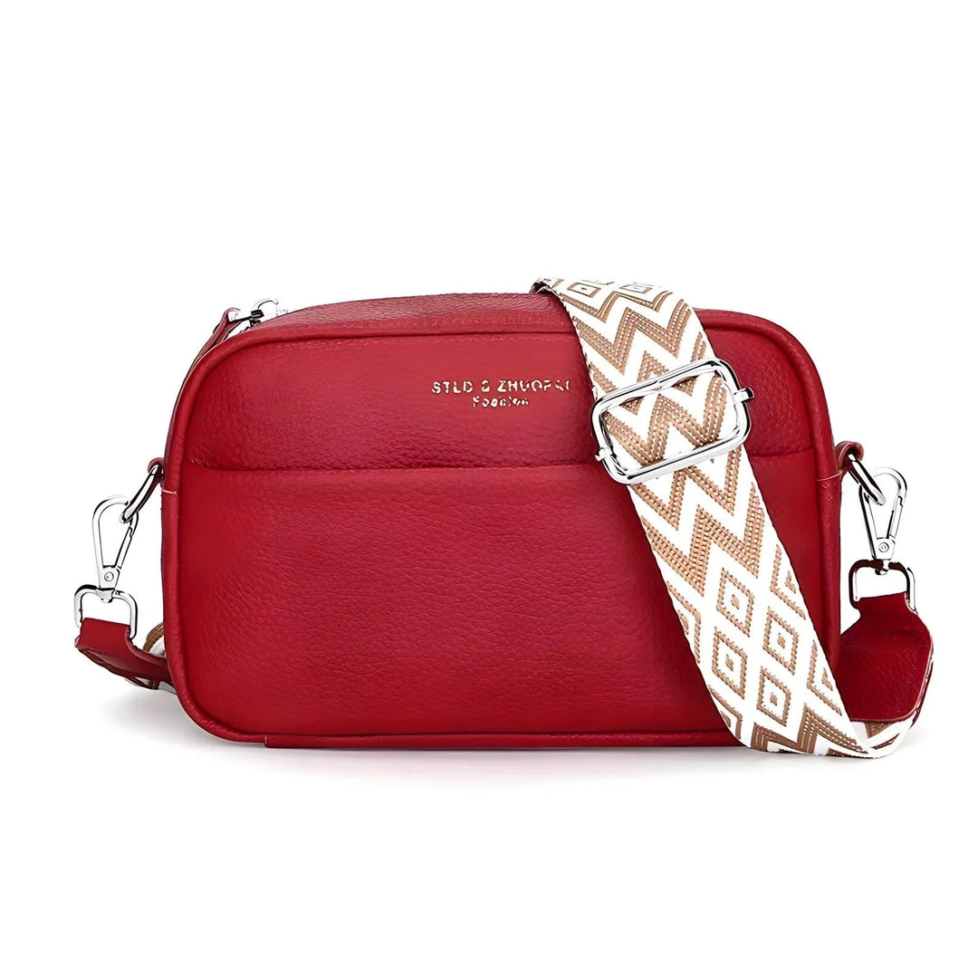 Stylowa torba crossbody z metalowymi okuciami, detale zamka