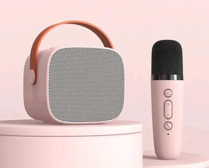 Wysokiej jakości sprzęt muzyczny – system karaoke z głośnikiem i mikrofonem, do domowej rozrywki.