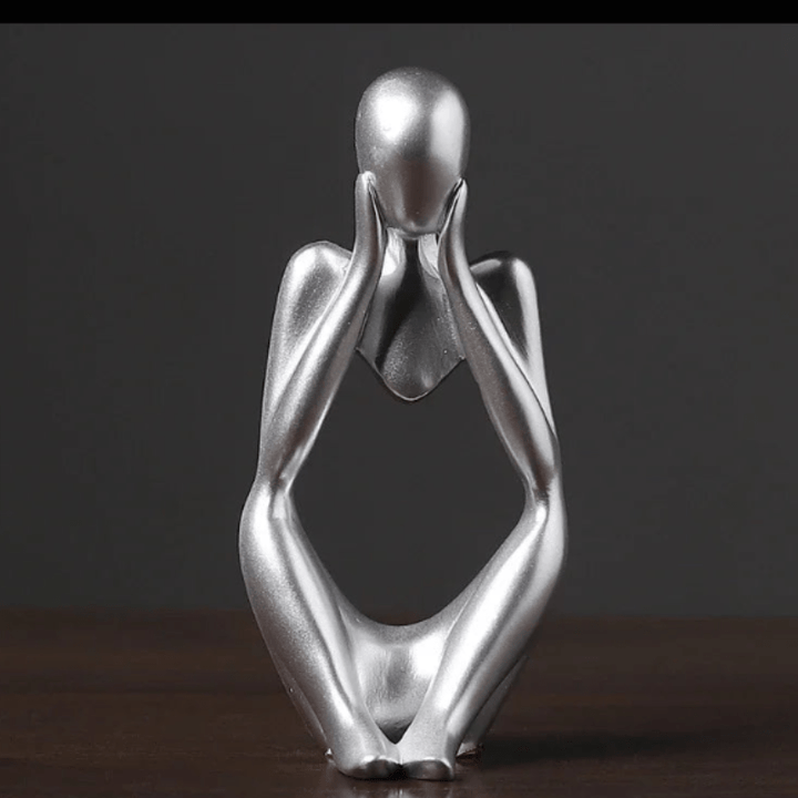 Dekoracja biura: figurka Myśliciela, abstrakcyjna i elegancka, symbolizująca myślenie, czarna.