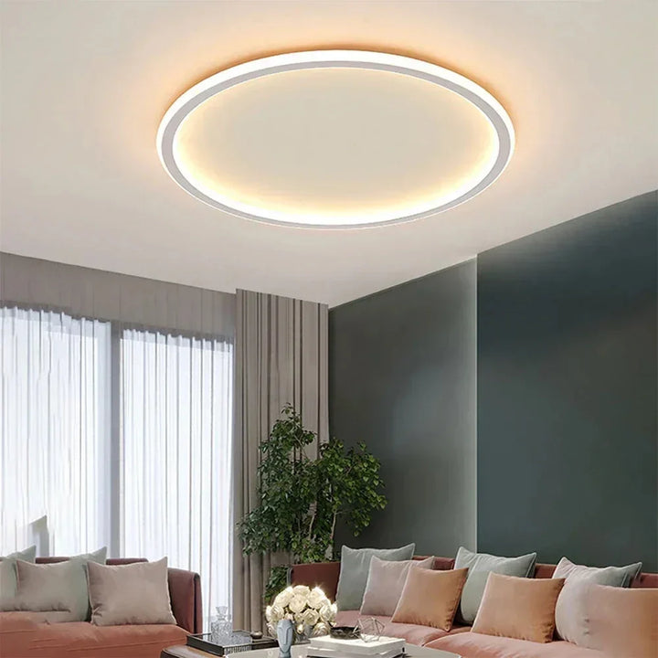Nowoczesna lampa sufitowa LED o minimalistycznym, okrągłym designie. Idealne oświetlenie do salonu lub sypialni.