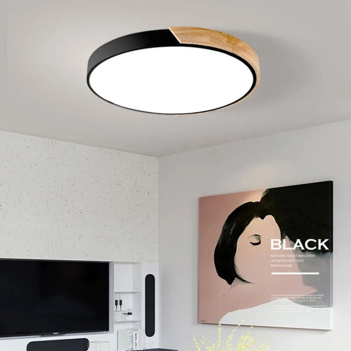 Minimalistyczna, okrągła lampa sufitowa LED w stylu skandynawskim do nowoczesnych wnętrz.