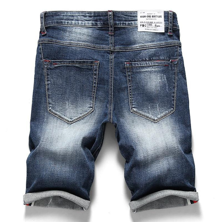 Modne męskie szorty jeansowe slim fit. Niebieskie, casualowe spodenki męskie idealne na letnie dni.