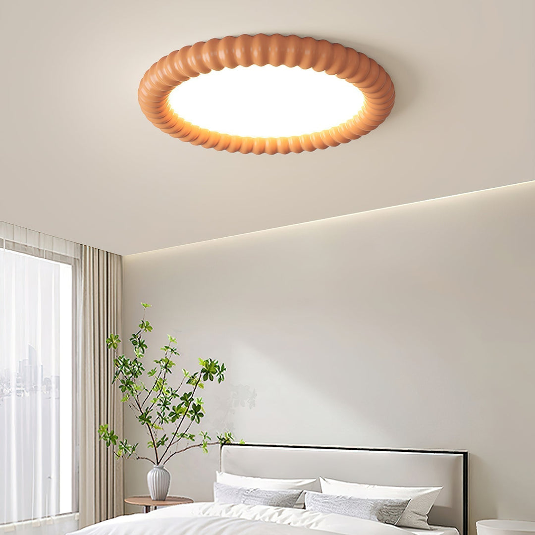Elegancka lampa sufitowa do salonu, nowoczesne oświetlenie z efektem halo i symetrii.