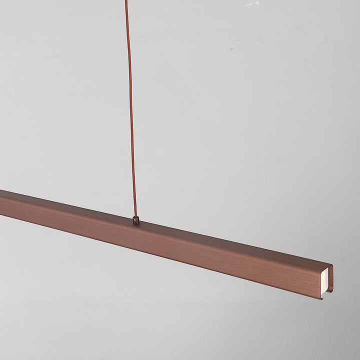 Lampa wisząca LED liniowa. Tworzy przyjemne, nowoczesne oświetlenie ambientowe w salonie.