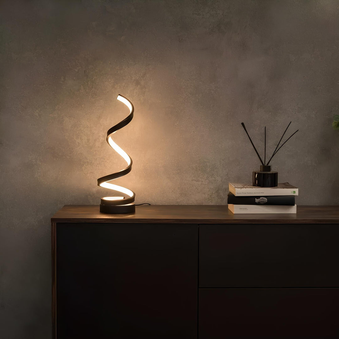 Nowoczesna spiralna lampa stołowa LED z regulacją jasności. Eleganckie oświetlenie dekoracyjne wnętrza.