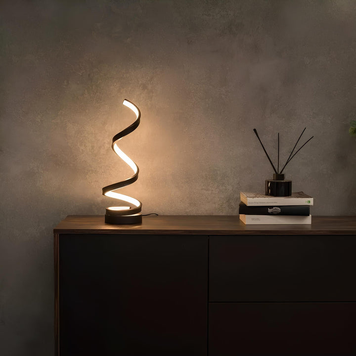 Nowoczesna spiralna lampa stołowa LED z regulacją jasności. Eleganckie oświetlenie dekoracyjne wnętrza.