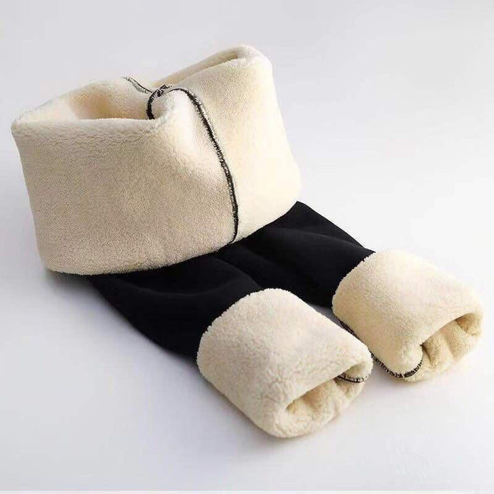 Eleganckie gładkie legginsy damskie z wysokim stanem, ocieplane polarem. Czarne, modne i wygodne na jesień/zimę.
