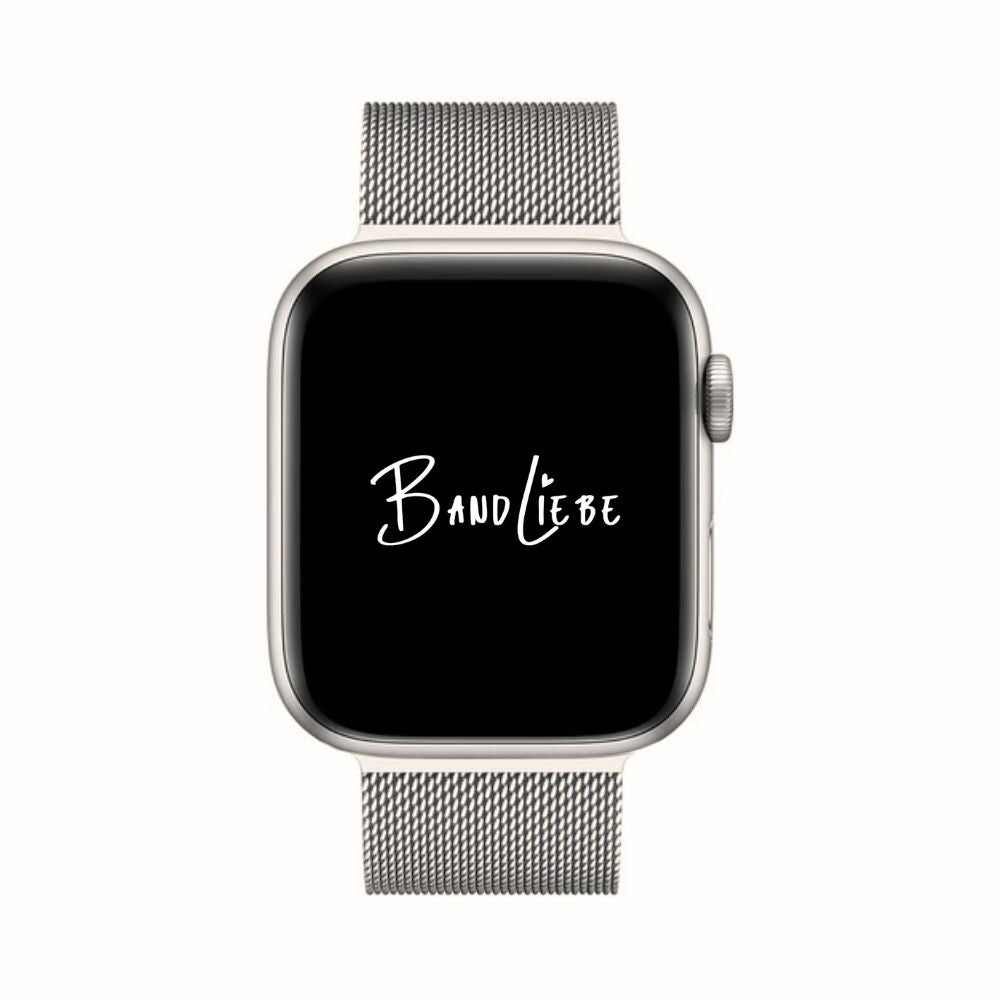 Srebrny pasek Milanese SteelFlex zamontowany na Apple Watch z widoczną tarczą