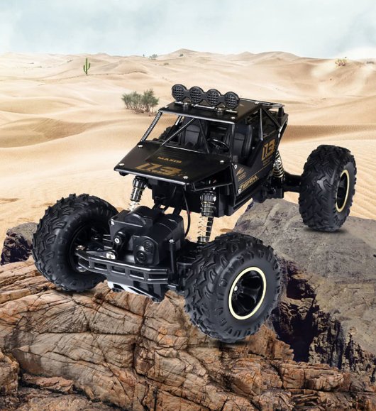 Duże, amortyzowane koła terenowego monster trucka RC, zapewniające stabilność i wydajność.