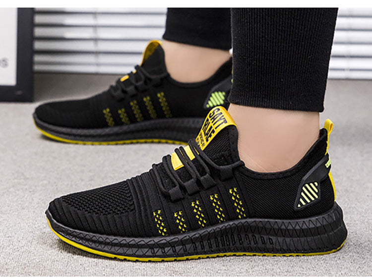 Czarne buty sportowe męskie, profil obuwia treningowego z żółtymi detalami
